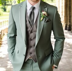 a man in a green suit and tie