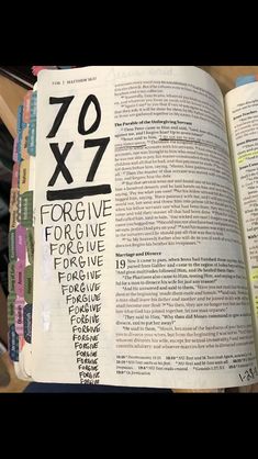 an open bible with the words 70x7 and negatives written in black on it