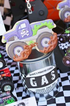 monster truck cookies in a can on a table