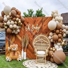 an outdoor baby shower with balloons and teddy bears