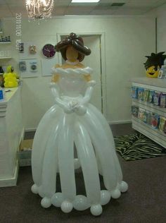 an inflatable wedding dress is displayed at a children's store