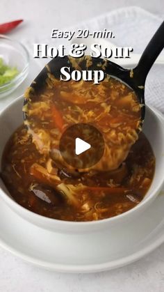 a white bowl filled with soup on top of a table