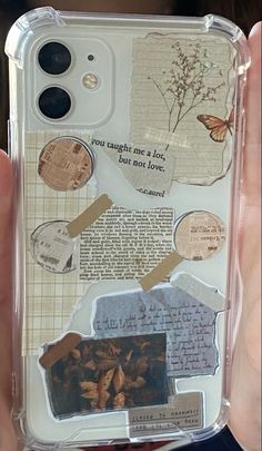 someone is holding up their phone case with some pictures on it, and there are other things in the case