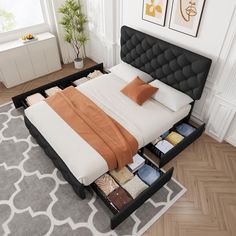 a bed with drawers underneath it in a room