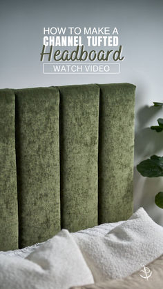 a green headboard sitting on top of a bed next to a white pillow and potted plant