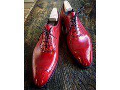 Elevate your shoe game with these bespoke leather handmade shoes. Made with genuine leather, these oxfords come in Red, and are available in all US, UK, EU, and AU sizes. The comfortable insole and standard shoe width make them perfect for any occasion. Designed with a solid pattern and lace-up closure, these handmade shoes are a vintage addition to any wardrobe. The leather outsole adds durability and longevity to these unique boots. Customize them to your liking with personalization options av Red Goodyear Welted Lace-up Oxfords, Red Oxford Oxfords With Leather Sole, Red Oxfords With Leather Sole, Red Goodyear Welted Wingtip Oxfords, Red Brogue Oxfords For Derby, Red Oxford Dress Shoes For Formal Occasions, Red Lace-up Dress Shoes For Business, Red Oxfords With Goodyear Welted Plain Toe, Red Plain Toe Oxfords With Goodyear Welt