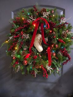 a christmas wreath hanging on the front door