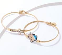 A sweet and subtle nod to your faith, this set of two inspirational bangles pairs a wire-wrapped design with faith-based charms as fab focal points. From Luca & Danni. Inspirational Stackable Friendship Jewelry, Footprints In The Sand, Fitness Jewelry, Adaptive Clothing, Beauty Storage, Focal Points, Makeup Mirrors, Ring Watch, American Leather