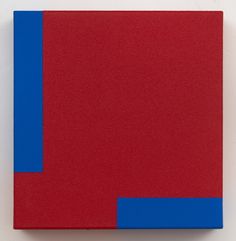 a red and blue painting on a white wall