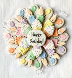 decorated cookies arranged in the shape of a happy birthday