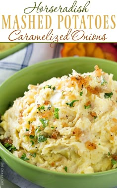 mashed potatoes in a green bowl with parsley on top