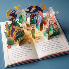 an open book with paper cut out of it