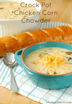 a bowl of crock pot chicken corn chowder next to a loaf of bread