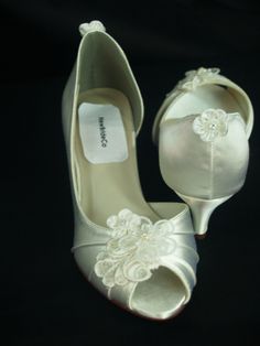 Wedding Peep toes satin shoes! Hand embellished with a vintage applique, a beautiful corded organza flower, and a small satin flower; elements used: pearls and tiny crystals; the back of the shoe is adorned with a cute satin flower. Please look at the pictures for details! Please note: white shoes have a slightly different lace under the flower than on the ivory ones. To buy color swatches: www.etsy.com/swatches/129787069/buy-color-swatch-samples-or-buy-lace FINAL SALE! THESE SHOES DESIGNS ARE N Kitten Wedding Heels, Small White Heels, Kitten Heels Wedding, Classic Wedding Shoes, White Kitten Heels, Small Heels, Kitten Heel Wedding Shoes, Vintage Applique, Flower Elements