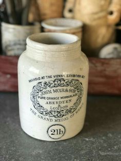 a white jar sitting on top of a table