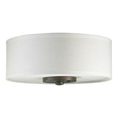 a light fixture with a white shade on it