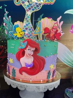 the little mermaid cake is decorated with fondant