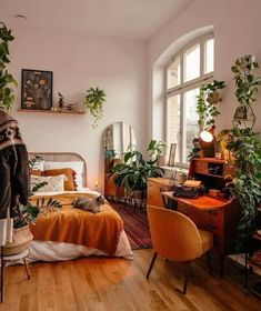 a bed room with a neatly made bed and lots of plants