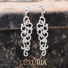 Prom dress evening gown or bridal waterfall dangling earrings.  Wholesale silver jewellery, worldwide delivery.  Luxuria jewellery Silver Bridal Jewellery, Prom Dress Evening, Wholesale Silver Jewelry, Prom Earrings, Bridal Jewelry Collection, Earrings Diamond, Diamond Simulant, Proposal Ring, Dress Evening