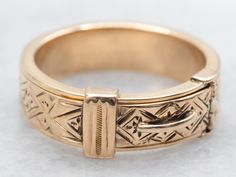 Made from yellow gold, this hinged band adds a touch of sophistication to any outfit. The "Ginnie" engraving adds a personal and meaningful touch, making it the perfect gift for yourself or a loved one. Experience the timeless beauty and unique style of this exquisite piece.Metal: 14K Yellow GoldWidth of Band: 6.5 mmHeight off Finger: 3.2 mmRing Size: 6.25Engraving: "Ginnie"Marks: "14K" Stamped on the inside band Pocket Watch Chain, Watch Chain, Pearl Pendant, Charm Earrings, Beaded Chain, Shop Necklaces, Timeless Beauty, Shop Earrings, Wedding Rings Engagement