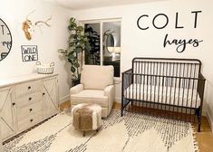 a baby's room with a crib, chair, dresser and clock on the wall