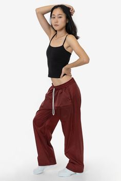 These lightweight nylon pants feature an extra wide, baggy straight leg fit. They feature 2 side pockets, 1 back pocket with velcro closure, and an elastic waistband with drawcord for an adjustable fit. These pants are unlined, making them super compact for traveling and versatile for different climates and weather needs. This fabric is great for maintaining body heat making these pants ideal for warm-ups and more. Please note: Lighter colors are slightly see-through! Try pairing with a bodysuit 2023 Aesthetic, Pant For Women, Nylon Pants, Wide Leg Pant, Body Heat, Baggy Fits, Neon Pink, Fashion Pants, Back Pocket