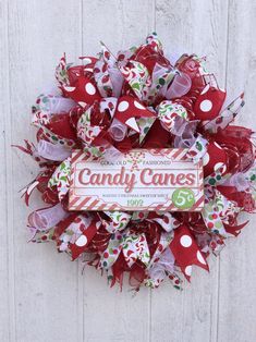 a candy cane wreath hanging on the side of a door