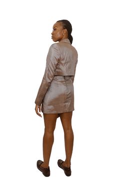 These 'Eko' cropped taffeta blazer & asymmetrical wrap front mini skirt set takes cues from architecture. With clean lines and a minimalist silhouette, the 'Eko' blazer is cut from crisp, shiny taffeta with padded shoulders and a cropped waist. Mirror the runway's mood by teaming it with the coordinating skirt or high-rise tailoring. *once sold out, this particular color will not be restocked Details & Fit Locally sourced from deadstock fabric in Lagos, Nigeria Cropped length Internal shoulder p Taffeta Blazer, Deadstock Fabric, Mini Skirt Set, Minimalist Silhouette, Wrap Mini Skirt, Lagos Nigeria, Blazer Set, Cropped Blazer, Asymmetrical Skirt