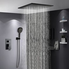 a shower head with the rain running down it's side and shelves on either side