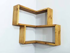 two square wooden shelves mounted to the wall