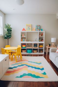 a child's playroom with toys, bookshelves and table in it