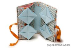 an origami box with four pieces of folded paper