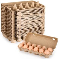 an egg carton filled with eggs next to another cardboard box full of brown eggs