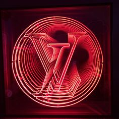 a red neon sign with the letter z in it's center is lit up