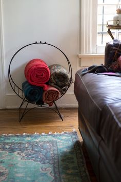 a bed with blankets and pillows on top of it