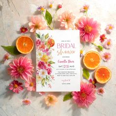 a bridal shower with flowers and oranges