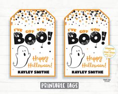 two halloween tags with the words boo and happy halloween written on them, both in black and orange