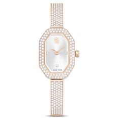 Capturing the beauty of Swarovski’s iconic octagon shape, this Dextera bangle watch offers a meticulous display of symmetry around the wrist. The 20mm x 30.5mm case features a champagne gold-tone finish and is adorned with a pavé of 92 crystals on the bezel. This provides a perfect frame for the sunray dial, which features a swan logo at 12 o’clock and three crystallized index markers. Along with a single dazzling stone set in the crown, the watch is also brought to life by 194 crystals set along the adjustable bracelet, providing exceptional beauty at every hour. This Swiss made watch is water resistant to 30m and combines joyful extravagance with signature Swarovski savoir-faire. Champagne Gold Color, Swan Logo, Bangle Watches, Octagon Shape, Metal Bracelet, Swarovski Jewelry, Silver Pendants, Single Earring, Champagne Gold