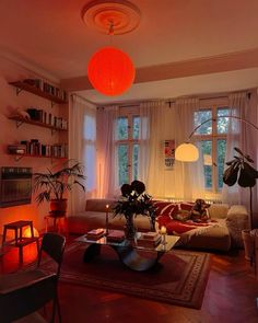 a living room filled with furniture and lots of windows