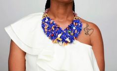 Meet "Itoro"! Her name means Praise in the African language. She is what we like to call a handmade beautiful mess of vibrant blue seed beads embellished with a variety of ethnic beads that adds a unique flare. She is the epitome of statement fashion jewelry that adds the perfect pop of color to any outfit. Pair her with a nice denim button-up top or solid color blouse of choice and you are sure to command any room you enter! Features: Blue; Multi-colored ethnic beads & shells; Silver fish h Blue Beads For Festivals, Artisan Blue Beaded Necklaces, Bohemian Blue Beads For Party, Bohemian Blue Beaded Necklaces With Gold Beads, Traditional Blue Beaded Necklaces For Party, Bohemian Blue Beaded Necklace With Gold Beads, Blue Beaded Necklace With Tiny Beads For Party, Blue Beaded Necklaces With Tiny Beads For Party, Blue Beaded Necklace For Party