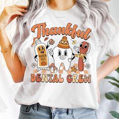 a woman with grey hair wearing a t - shirt that says, thank dental crew