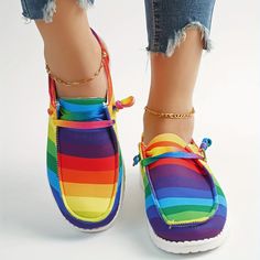 These rainbow striped canvas shoes for women have a lightweight design that provides both comfort and versatility, making them the perfect walking shoes. Made of breathable canvas, they are ideal for a variety of activities, whether it's a daily walk or a hike across challenging terrain. Item ID : TW16224 Patterned : Other Material : Canvas Toe Style : Round toe Multicolor Slip-on Canvas Shoes For Summer, Casual Multicolor Slip-on Canvas Shoes, Casual Multicolor Slip-on Sneakers For Summer, Comfortable Multicolor Slip-on Sneakers For Summer, Multicolor Cotton Canvas Shoes With Round Toe, Trendy Multicolor Canvas Shoes With Rubber Sole, Comfortable Multicolor Flat-heel Sneakers, Casual Striped Sneakers For Spring, Trendy Fabric Canvas Shoes