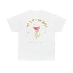 a white t - shirt with a glass of wine on it