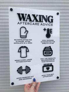 a sign that says waxing aftercare advice on the side of a building with instructions for how to use it