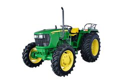 a green tractor with yellow wheels on a white background in front of a white backdrop