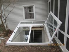 an open window on the side of a house