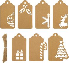 paper tags with christmas decorations on them and a string attached to the tag's side