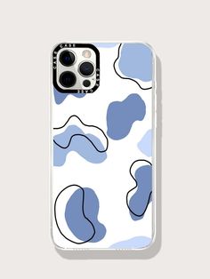 an iphone case with blue and white designs on the front, featuring black dots in the middle