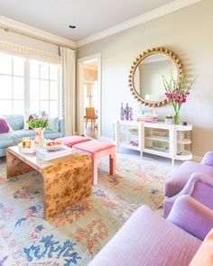 the living room is decorated in pastel colors