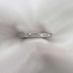 a white gold ring with diamonds on it